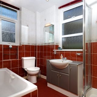 The ground floor bathroom provides a bath, shower cubicle, wash basin and toilet.