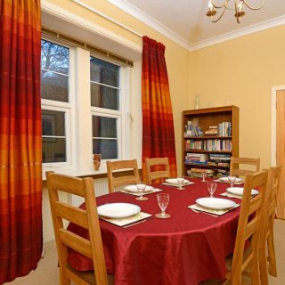 Overlooking the grounds, the dining room offers a relaxing location for meals.