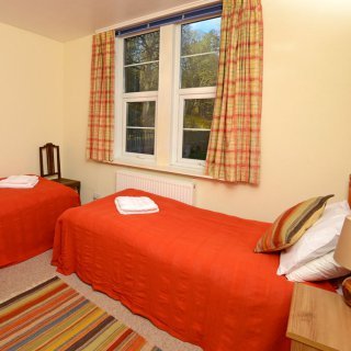 The twin bedroom on the ground floor affords views of the Estate.