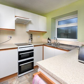 The well appointed kitchen has a cooker, microwave & dishwasher