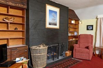 Woodsedge sitting room with open fire near Ravens Craig